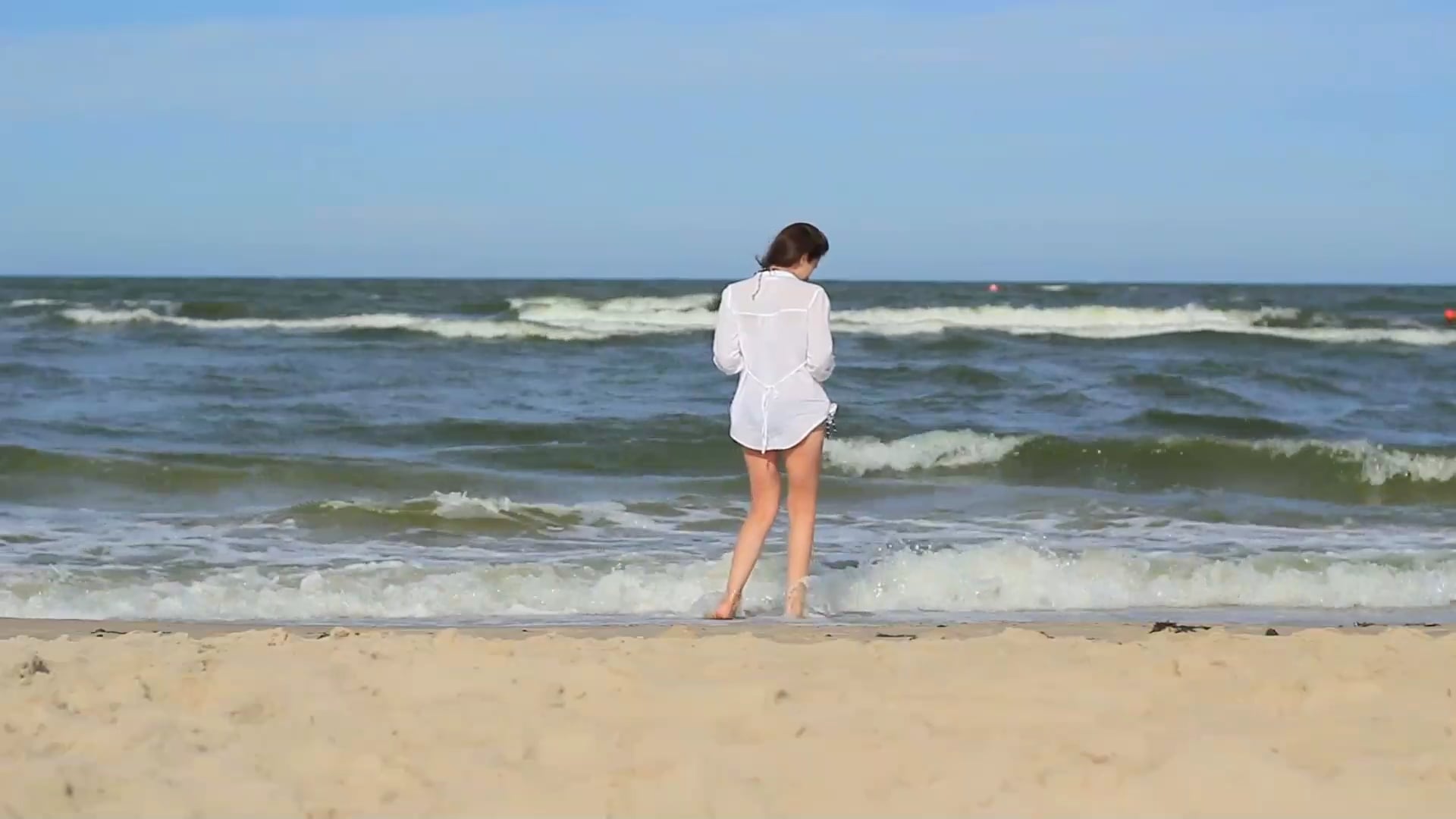 Girl At The Beach Walking Through Sea Water HD Free Stock Video Footage