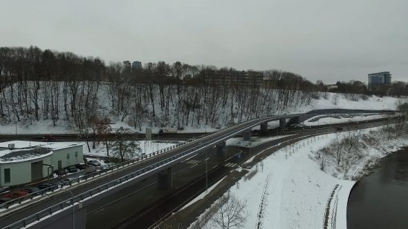Slow Landing Near River In City, Winter