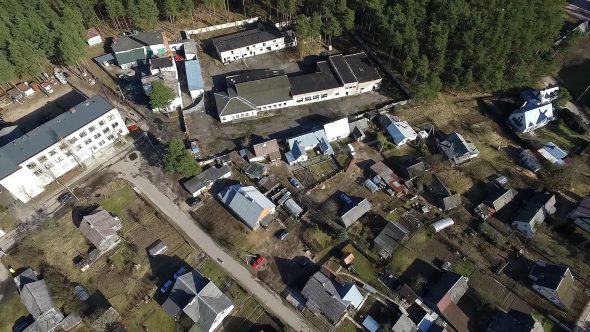 Flight Over Buildings Near Forest 3