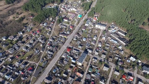 Flight Over Small Town Near Forest 1